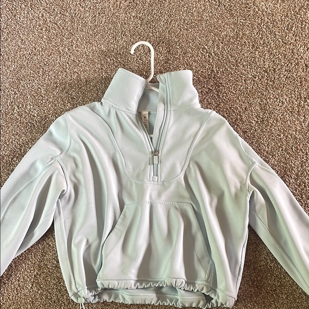 light blue quarter zip lululemon sweater.